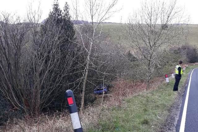 The vehicle can be seen at the bottom of a steep embankment.