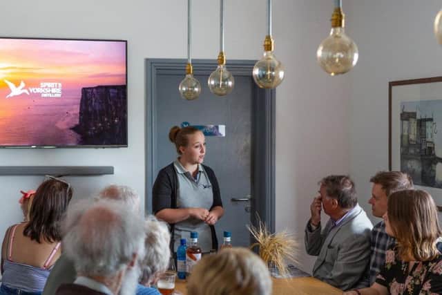 Chrissie Queen, standing, at the start of a Spirit of Yorkshire distillery tour