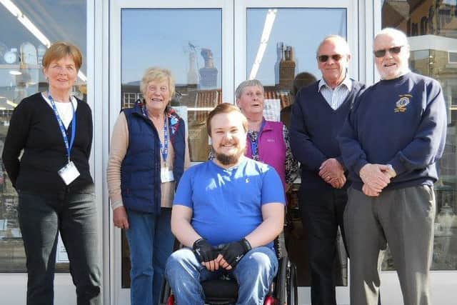 Three members of the S.A.L.T team with Josh Porritt (in the wheelchair) and two members of the Scarborough Lions Club.