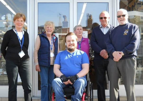Three members of the S.A.L.T team with Josh Porritt (in the wheelchair) and two members of the Scarborough Lions Club.