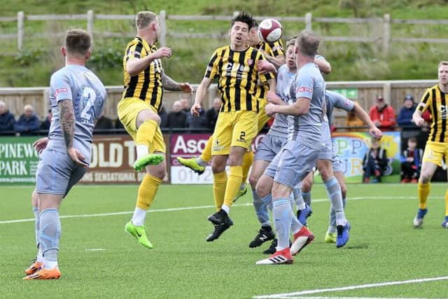 Jack Johnson wins a header during Saturday's mauling of Workington