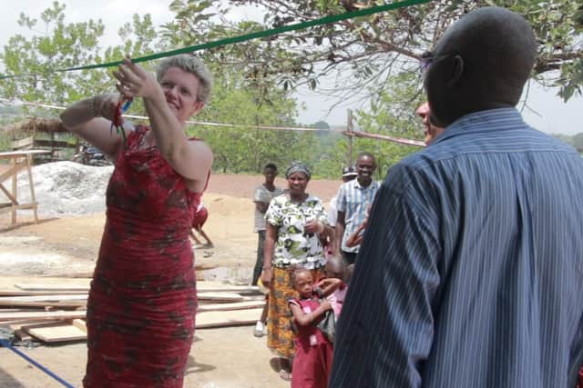 Kate Parker-Randall cuts the ribbon to open the new classroom block.