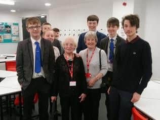 The tea party saw students serve hot drinks and cake to elderly members of the community