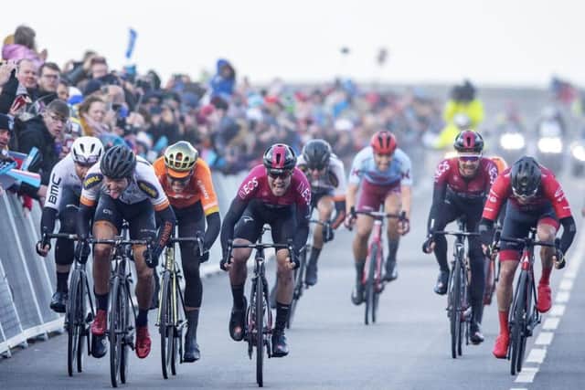 Alexander Kamp, second left, takes the win from Chris Lawless of Team Ineos