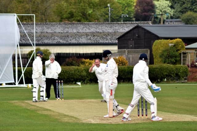 Brompton veteran Neil Fletcher gives Scalby batsman Ryan Labuschagne a send off. Picture by Simon Dobson.