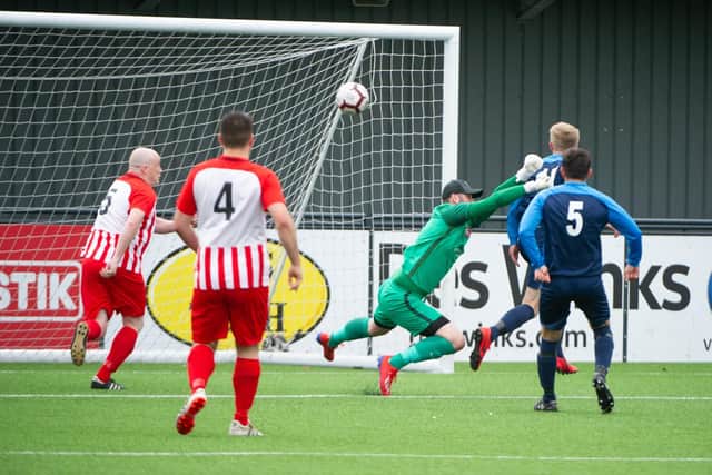 Rich Tolliday heads West Pier 2-1 in front against Hunmanby United
