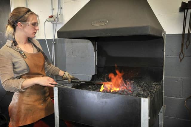 Blacksmith Katie Ventress works in her workshop in Hinderwell. Whitby. Preparing the metalwork.pic Richard Ponter 174032c
