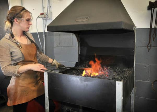 Blacksmith Katie Ventress works in her workshop in Hinderwell. Whitby. Preparing the metalwork.pic Richard Ponter 174032c