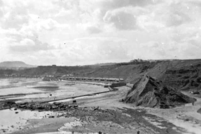 Picture shows a view of the North Bay with an undeveloped Scalby Mills in the foreground. The island on the right was known as Monkey Island and was a popular playground for many generations. The island was flattened when the sea wall and promenade were extended to northwards to Scalby Beck