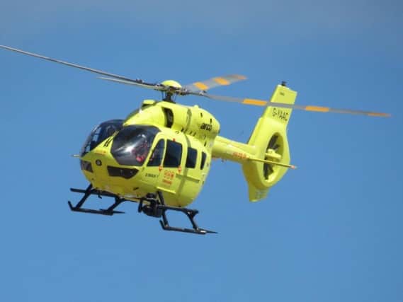 Images on Twitter show the Air Ambulance landing in the theme park near one of the rides