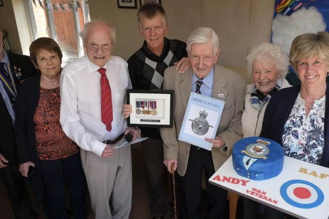 Brian Revell and Andrew Gauld celebrate their veterans badges with family and John Anderson BEM.