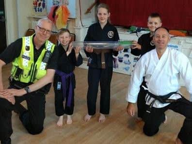 The handover of the weapon.