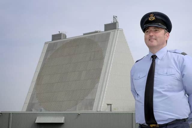 Flight Lieutenant Rich Weeks in front of the radar. PIC: Richard Ponter