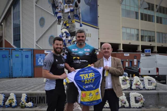 From left to right: Antony Woods of Defined Intervention, PC Pierre Olesqui and Paul Taylor of sponsors Harris CM, outside Elland Road.PIC: Candid PR