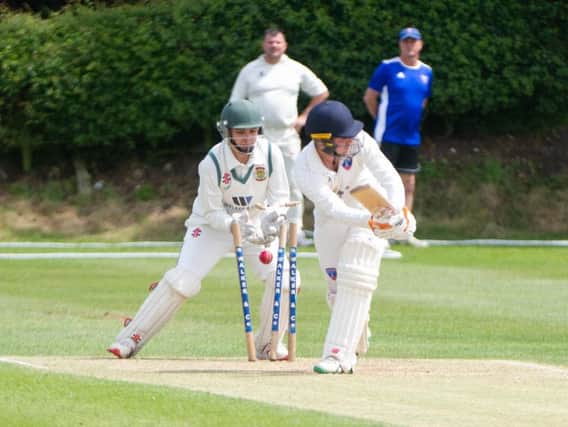 Cayton skipper Jake McAleese is bowled by Tom Norman in Folkton & Flixton's National Village Cup win. Picture by Andy Standing.