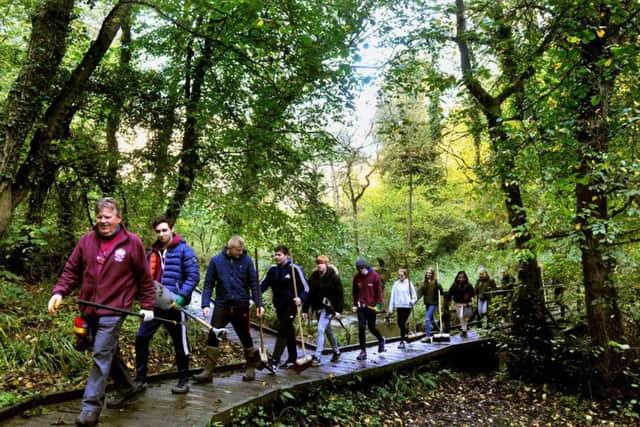 David Bream (left) a Volunteer Task Leader for the North York Moors National Park leadsa group of Bishop Burton College students clearing the boardwalk in 2018. PIC: Gary Longbottom