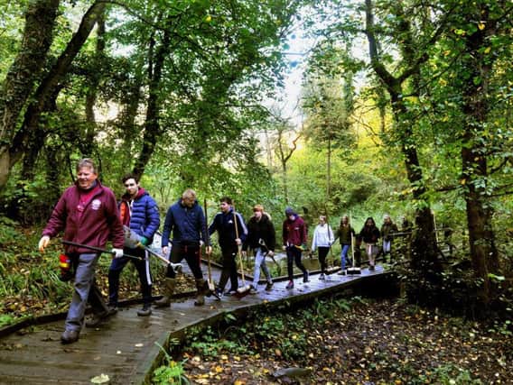 David Bream (left) a Volunteer Task Leader for the North York Moors National Park leadsa group of Bishop Burton College students clearing the boardwalk in 2018. PIC: Gary Longbottom