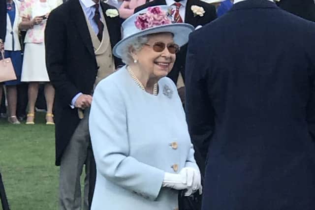 The Queen chats to guests.