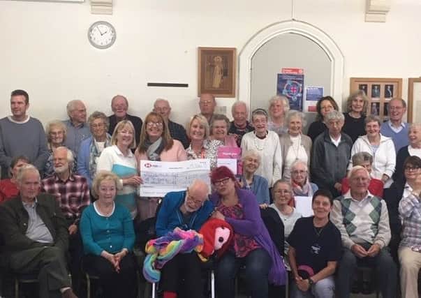 The Singing for the Brain group produced a CD which has raised £2,000.