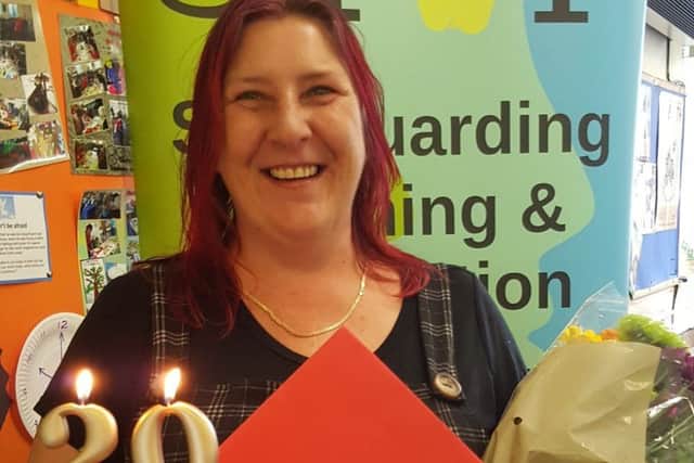 Helen Beevers with her flowers, cards and cake.
