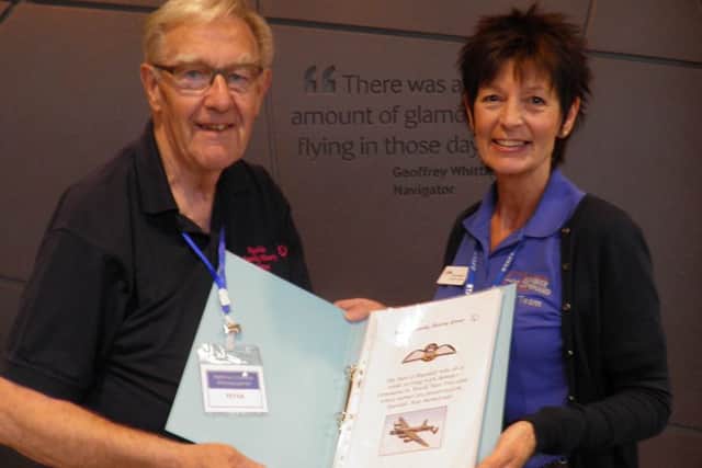 Peter Braithwaite presents a file on the Ryedale men to archivist Carol Gibson.