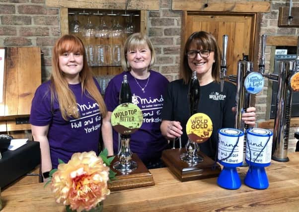 Anne Duerden from Wold Top Brewery with representatives from Mind.