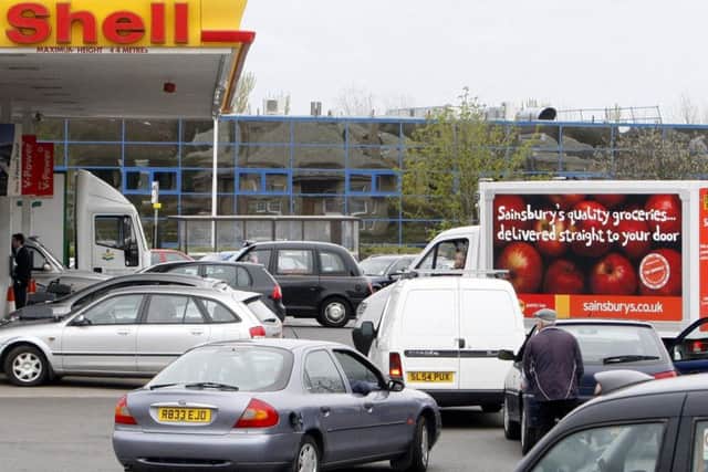 Cars queuing at a Shell garage..