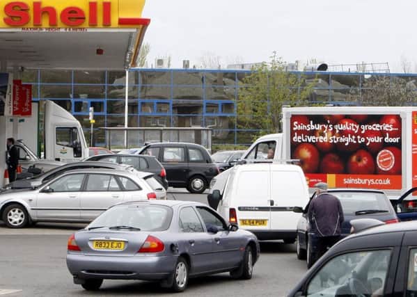 Cars queuing at a Shell garage..