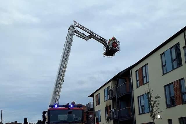 Firefighters tackle the blaze.