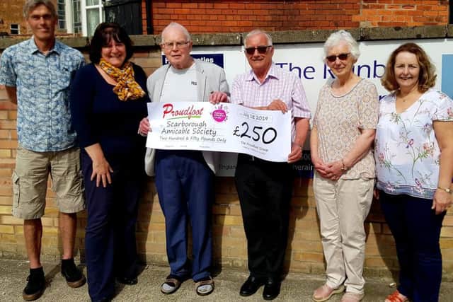 Valerie Aston presents the cheque to Scarborough Amicable Society.