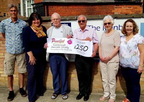Valerie Aston presents the cheque to Scarborough Amicable Society.