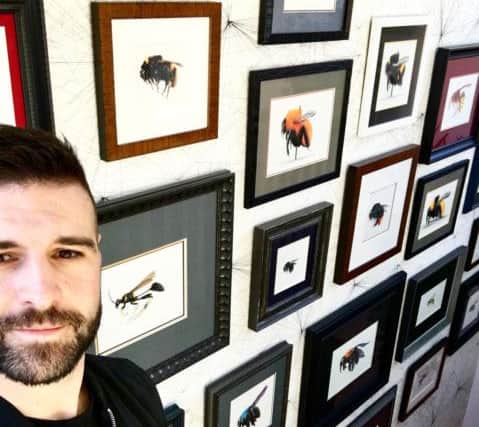 Scarborough-based artist Ryan Chadwick with some of his work.