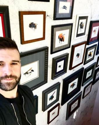 Scarborough-based artist Ryan Chadwick with some of his work.