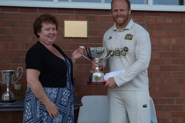 Heslerton skipper Sam Triffitt receives the Linda Goulding Memorial Cup from AndyHire's Sharon Blackstone last year. Picture: Simon Dobson