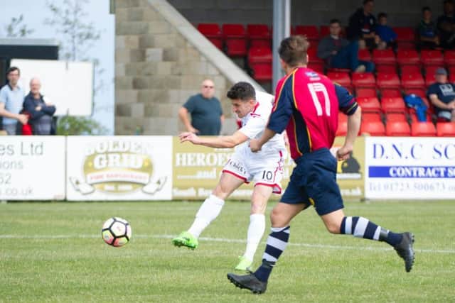 Michael Coulson opens the scoring for Scarborough Athletic against the Saturday League Rep side
PHOTO BY ANDY STANDING