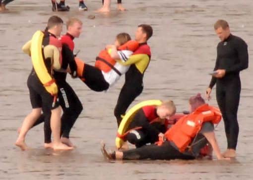 Lifeguards with 'casualties' on the beach at the South Bay.