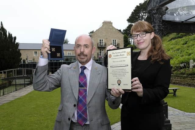 Raithwaite Hall Head Concierge Simon James with his Golden Keys award pictures with Estate Manager Helen Blower pic Richard Ponter