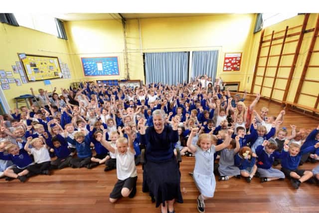 Staff and pupils cheer and wish Mrs Hoggarth good luck. PIC: Richard Ponter