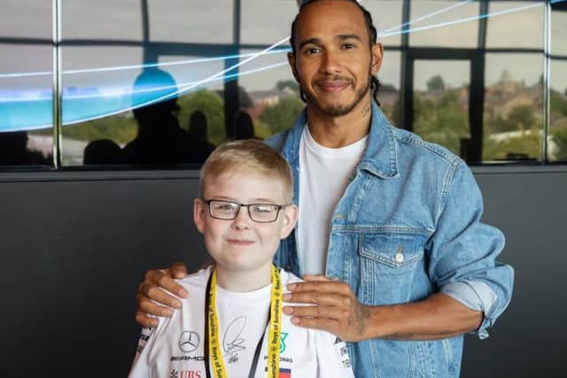 Jamie Winship meets his idol Lewis Hamilton.