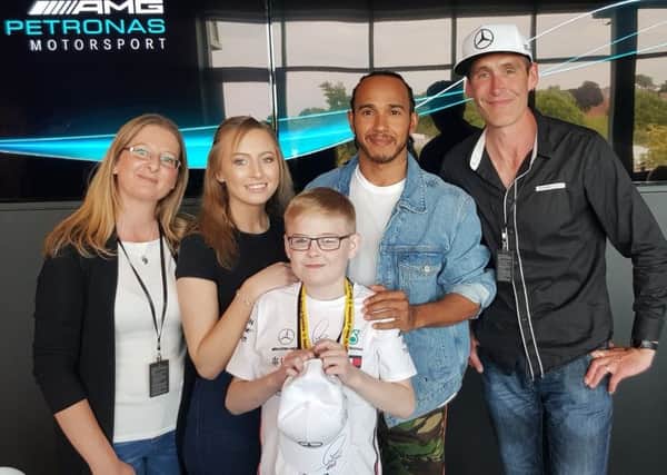 Jamie Winship at the Rays of Sunshine meet and greet with Formula 1 star Lewis Hamilton.