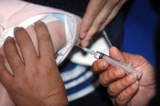 A small child is immunised.