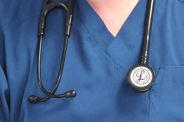 File photo dated 15/08/14 of a doctor. Emergency care doctors have said the NHS must step up its plans for dealing with flu after Australia was hit by a particularly bad outbreak of the virus.