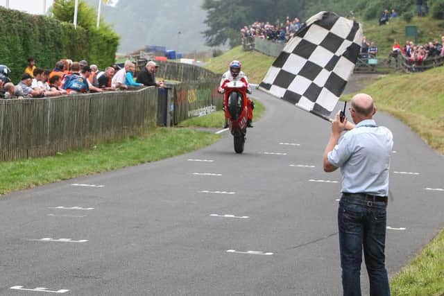 Carl Fogarty performs for the crowds. PIC: Edward J Hall/ Oliver's Mount Racing