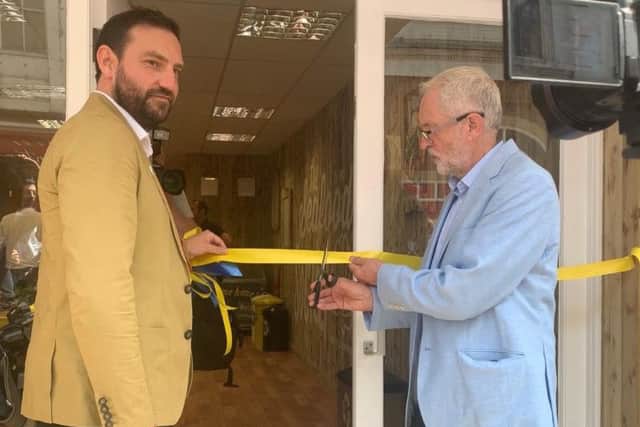 Jeremy Corbyn cuts the ribbon of new Seafood Social cafe.