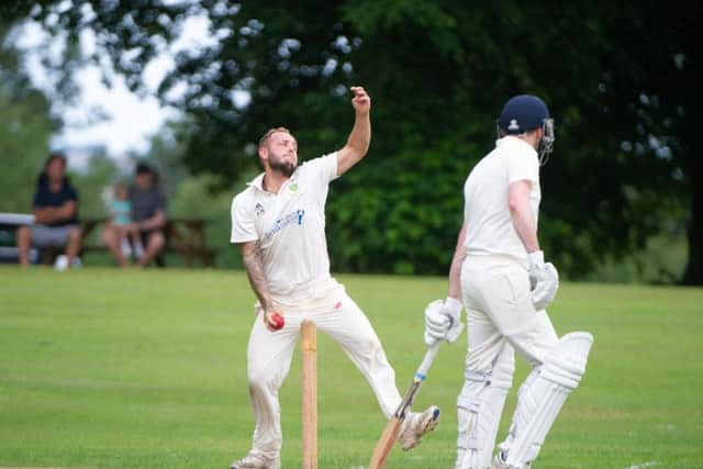 Alex White in bowling action for Cloughton at Wykeham in Division One. . PICTURES BY ANDY STANDING