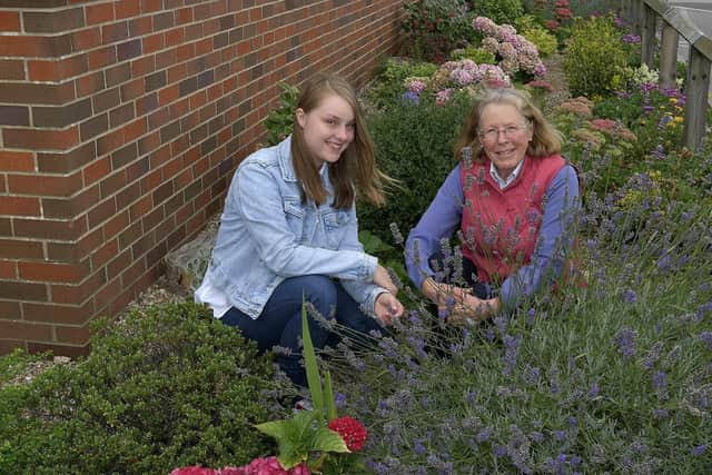 Kelsey Atkinson and Patricia Comb take a break in one of the rockery areas