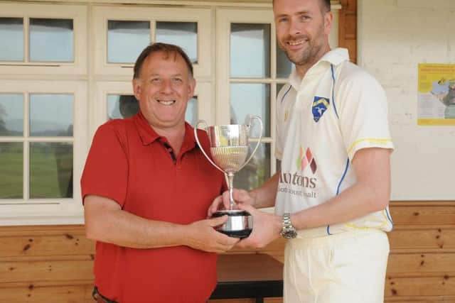 Malcolm Maw acting league secretary presents Sewerby Captain Ian Dennis with the Division 2 league winners trophy
PHOTOS BY DOM TAYLOR