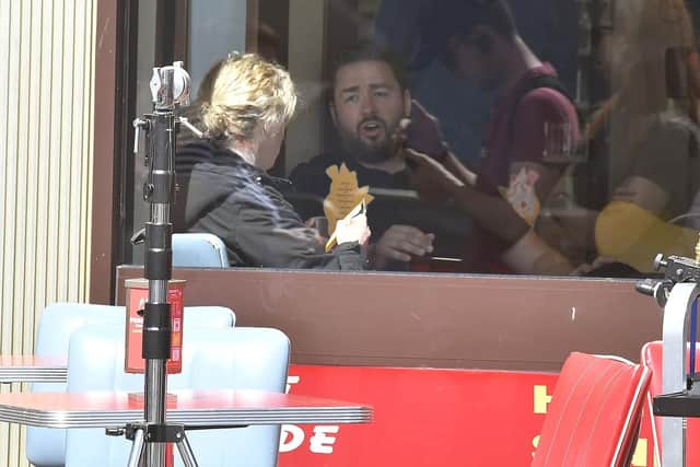 Jason Manford films inside Pacittos on the foreshore. PIC: Richard Ponter