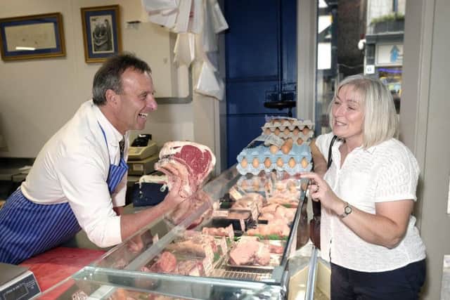 Mark Nockels serving a regular customer.