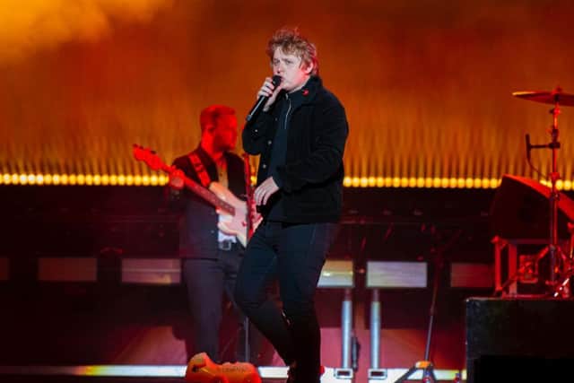 The Scot took to the stage in his usual outlandish manner to Here Comes the Money, the entrance music of WWE wrestler Shane McMahon.